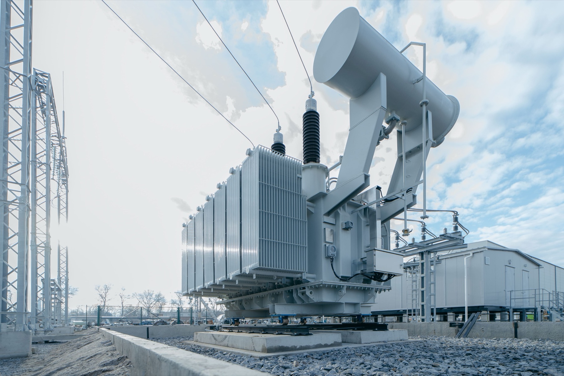 A high-voltage transformer and overhead lines at an electricity substation